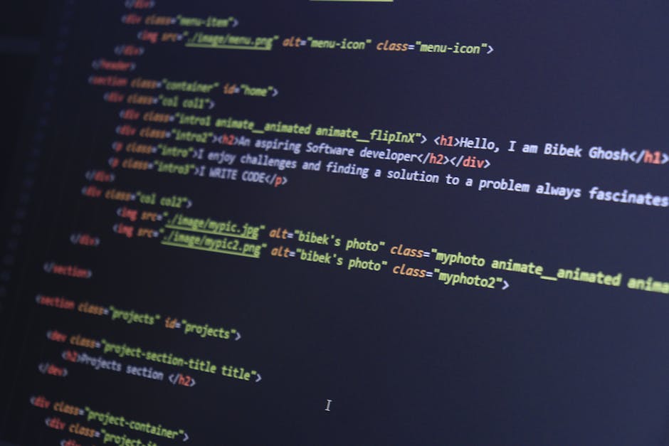 A computer screen displaying HTML code with tags such as <html>, <head>, <title>, and <link>, associated with web development. The code is color-coded with syntax highlighting, featuring blue, red, an